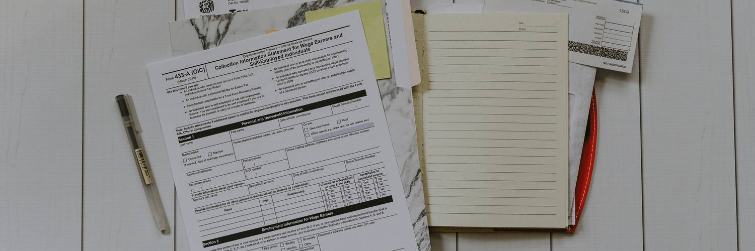 Stack of California eviction notice forms on a desk