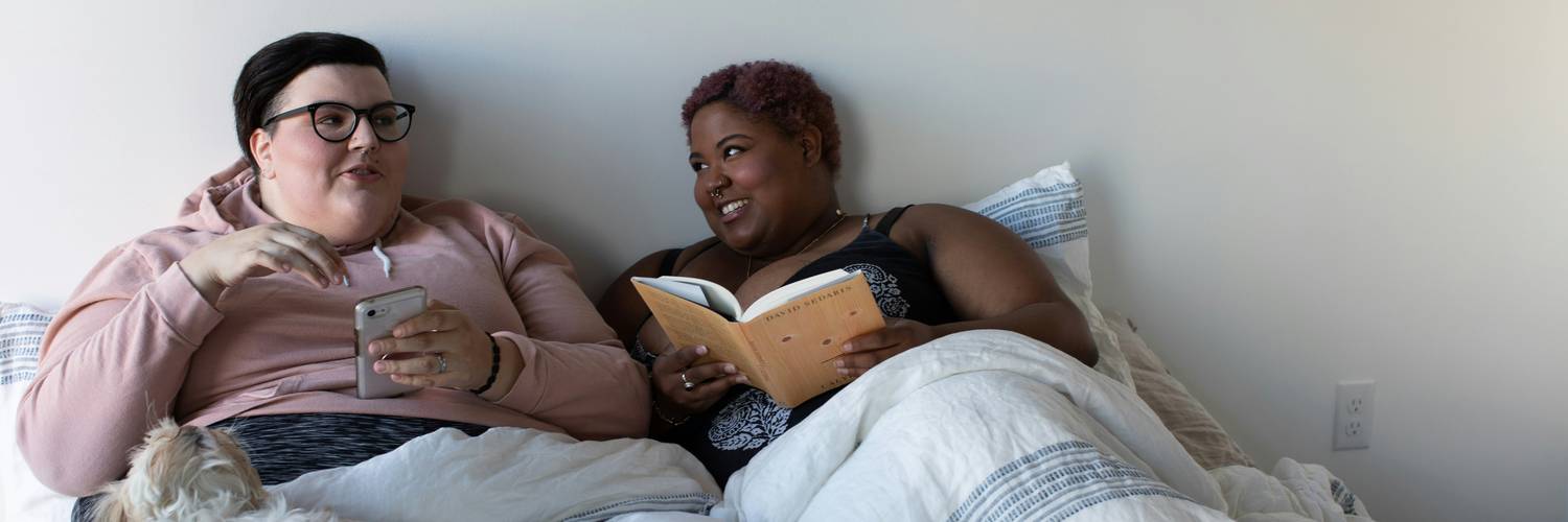 California tenants reading a fair-housing brochure together in their apartment