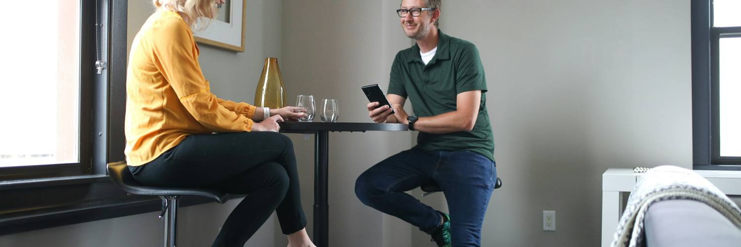 Couple reviewing a rental application while touring an apartment in California