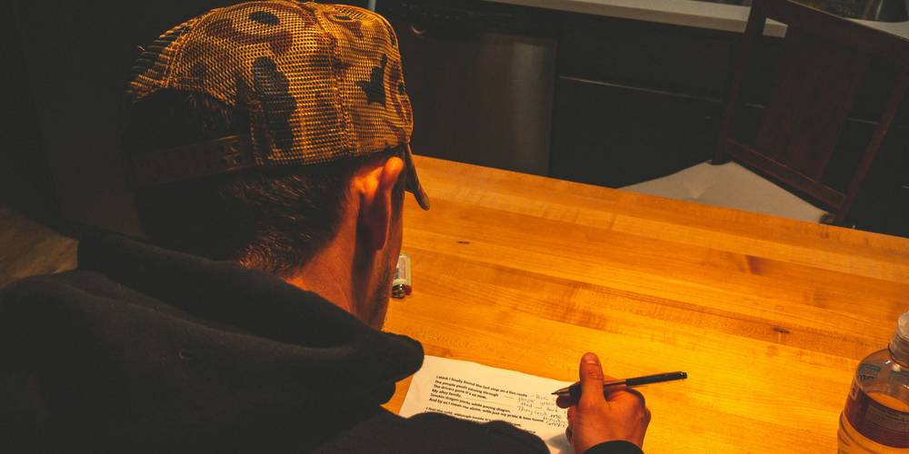 Roommates signing a shared lease in a California apartment